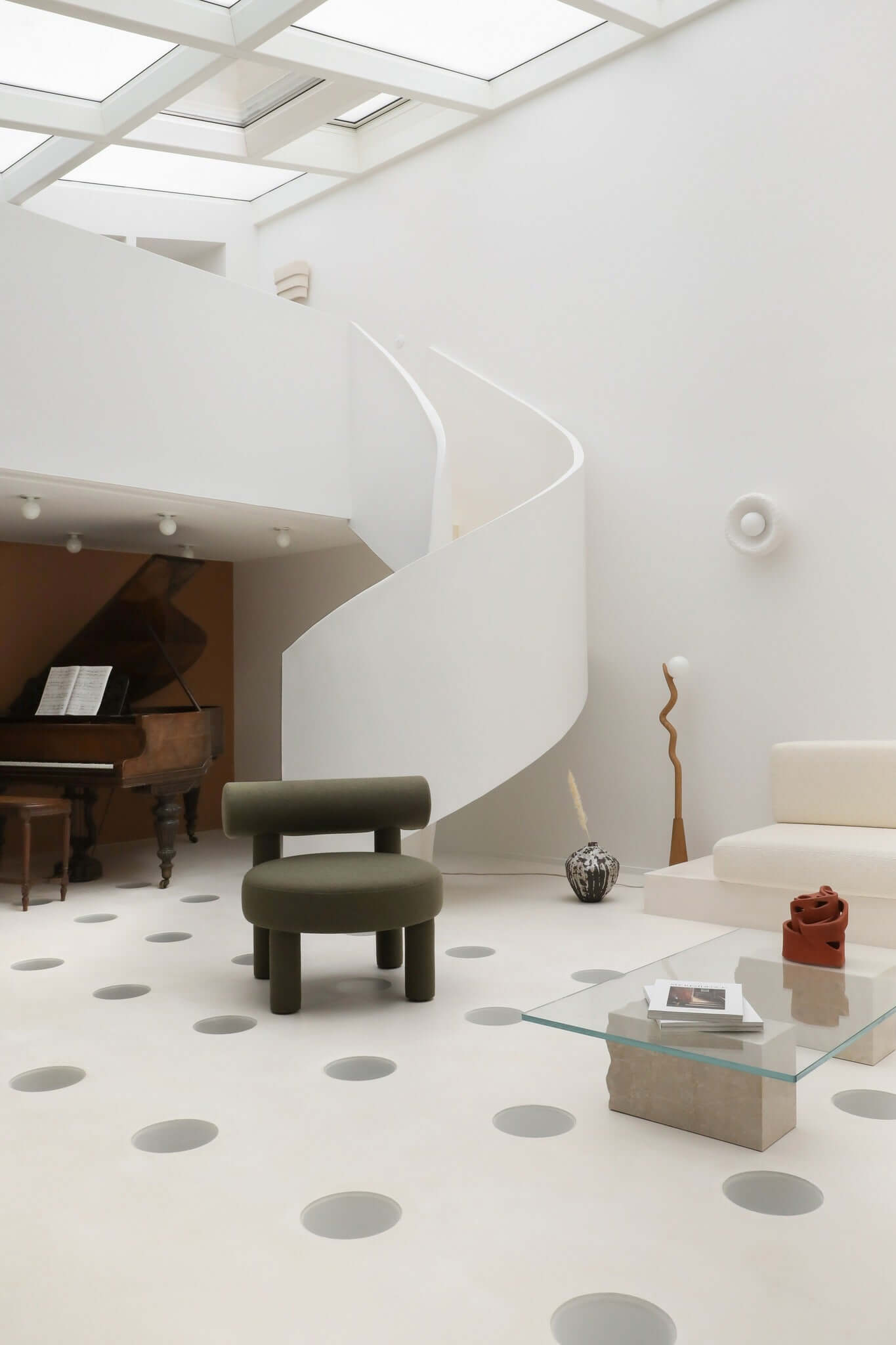 Modern living room with Gropius Low Chair CS1 by Noom, featuring minimalist design and geometric patterns, celebrating Bauhaus style.
