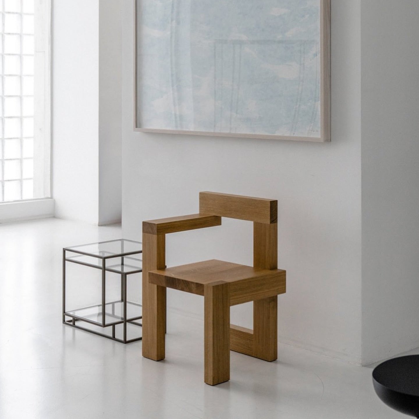 Wooden Steltman chair by Gerrit Rietveld, designed for Spectrum, showcasing modern minimalist style in a contemporary setting.