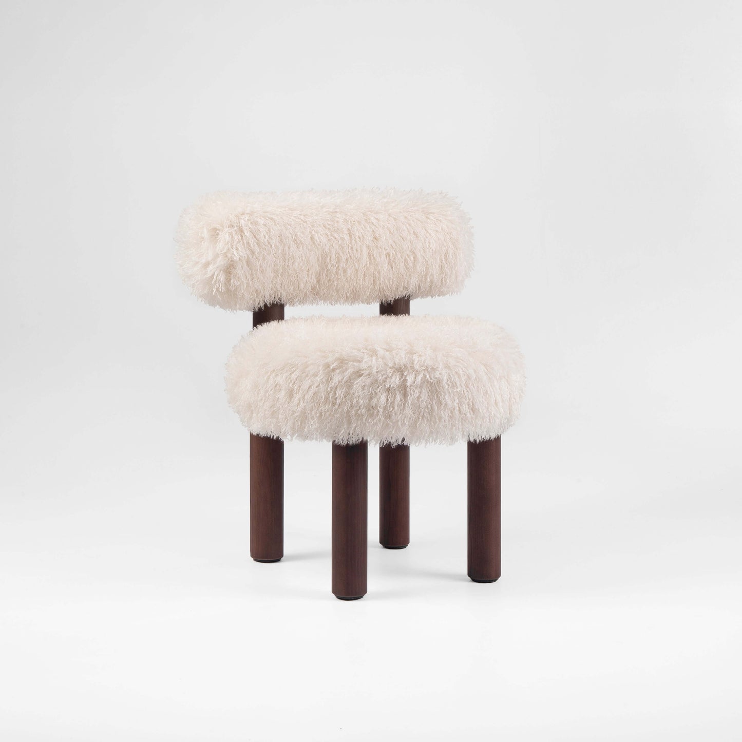 Gropius CS2 Fluffy Edition accent chair by Noom, designed by Kateryna Sokolova, featuring plush fabric and dark wooden legs.
