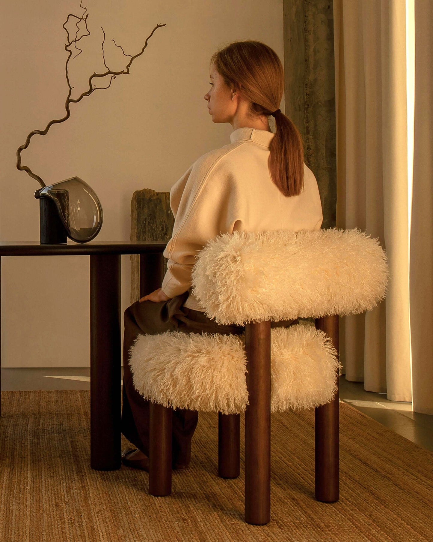 Gropius CS2 Fluffy Edition chair by Noom in cozy living room setup, featuring plush design and elegant accents.