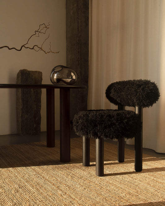Gropius CS2 Fluffy Edition accent chair by Noom in a modern interior, featuring a sleek black fluffy design and minimalist decor.
