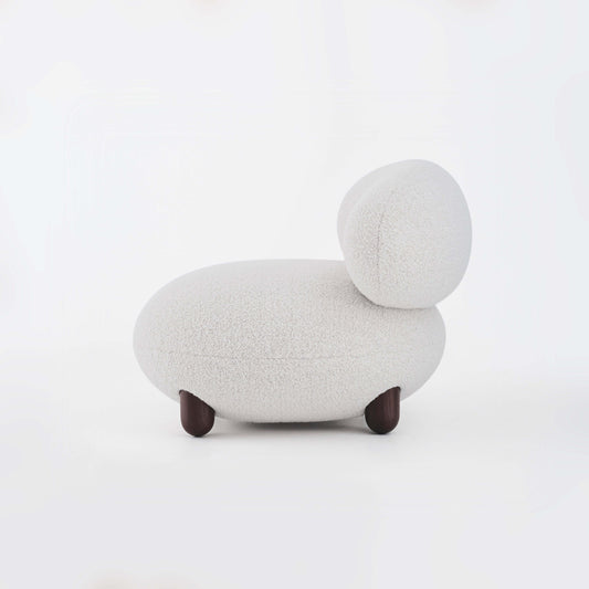 Modern Flock Lounge Chair by Noom with soft curves and natural materials for home comfort and style.