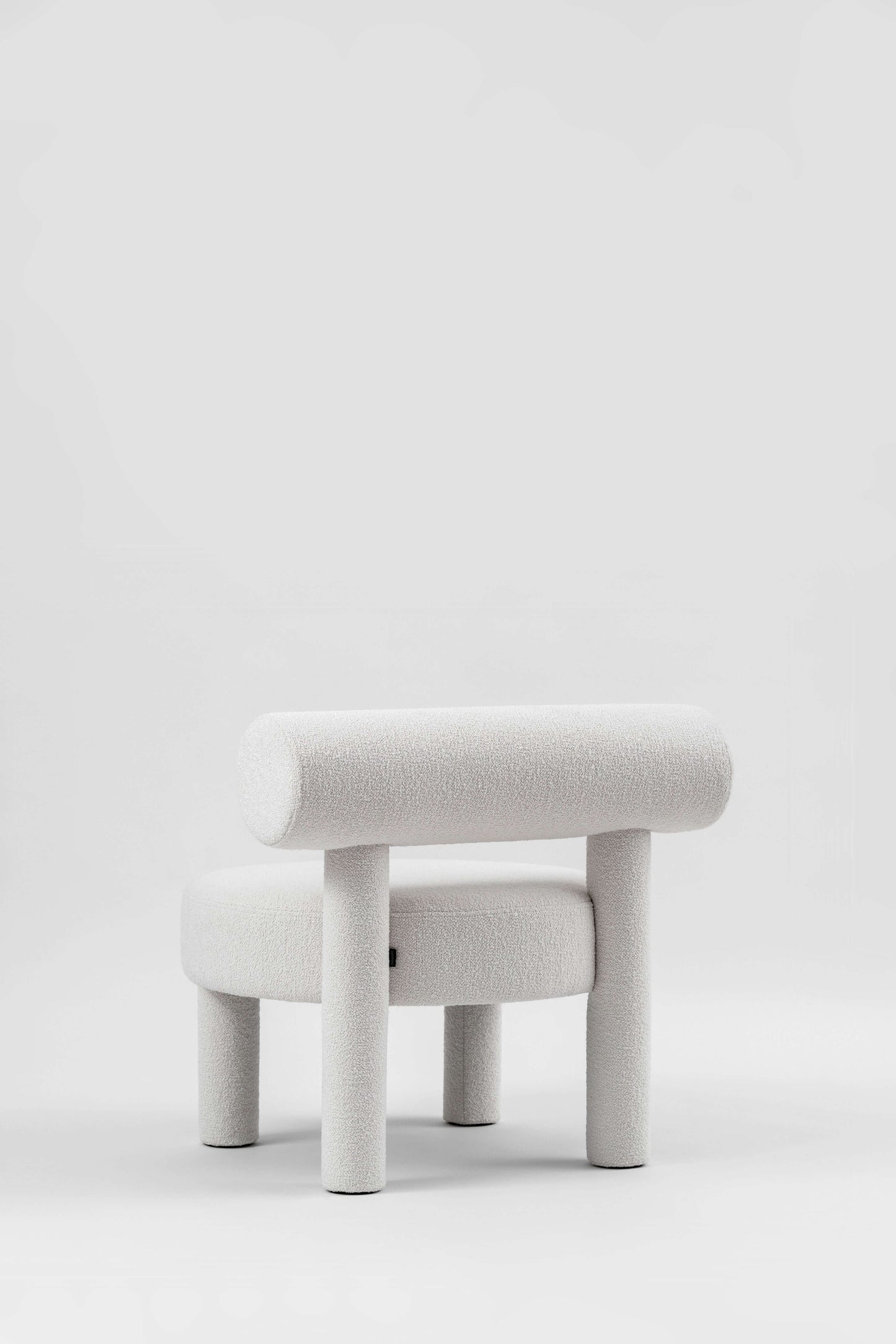 Gropius Low Chair CS1 by Noom, designed by Kateryna Sokolova, in white, celebrating Bauhaus style. Flock chair by Noom home.