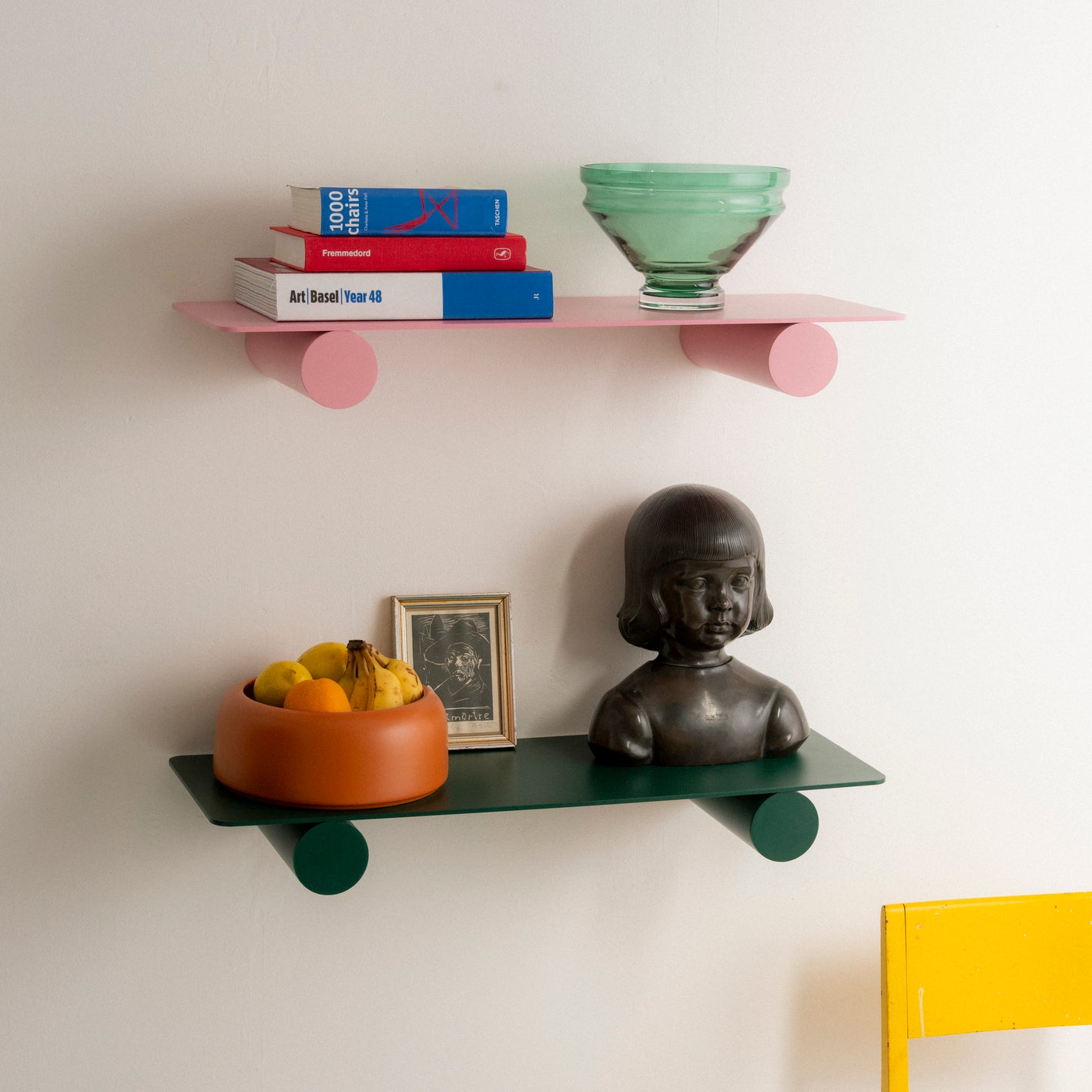Pipeline Duo shelf by Raawii featuring modern colourful bowls on a sleek metal design.