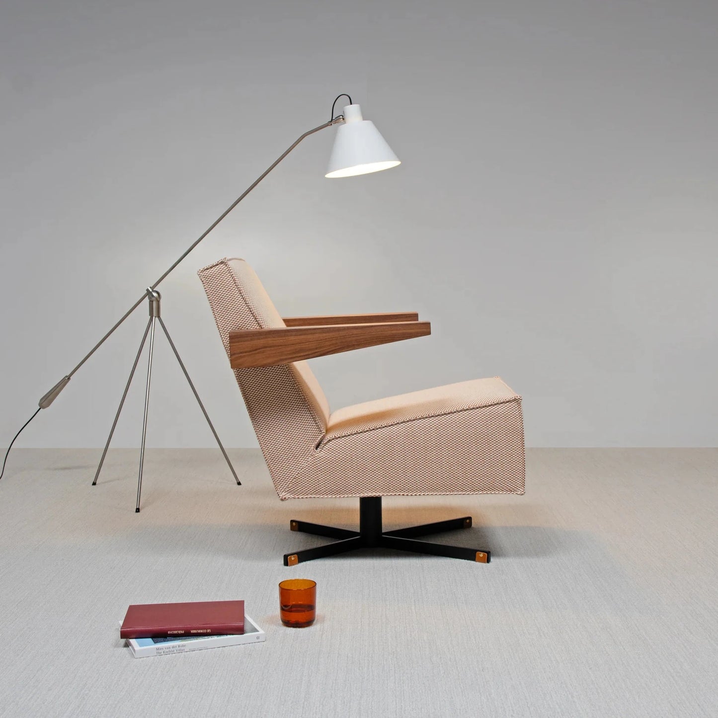 Press Room Chair by Spectrum, designed by Gerrit Rietveld, showcasing sleek lines and modern design with a lamp and accessories.