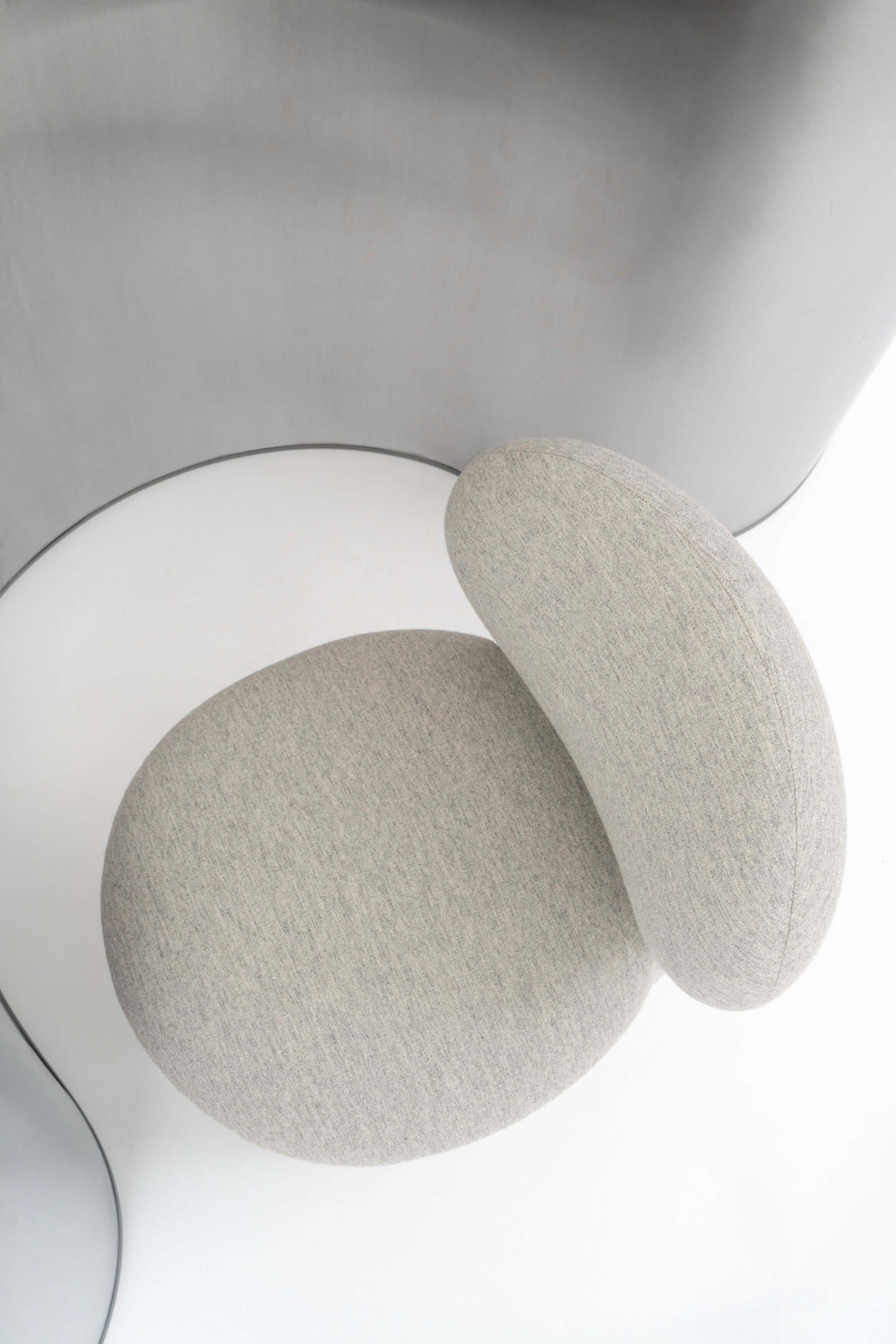 Modern designer Flock dining chair by NOOM home, featuring soft, rounded forms and a minimalist design.