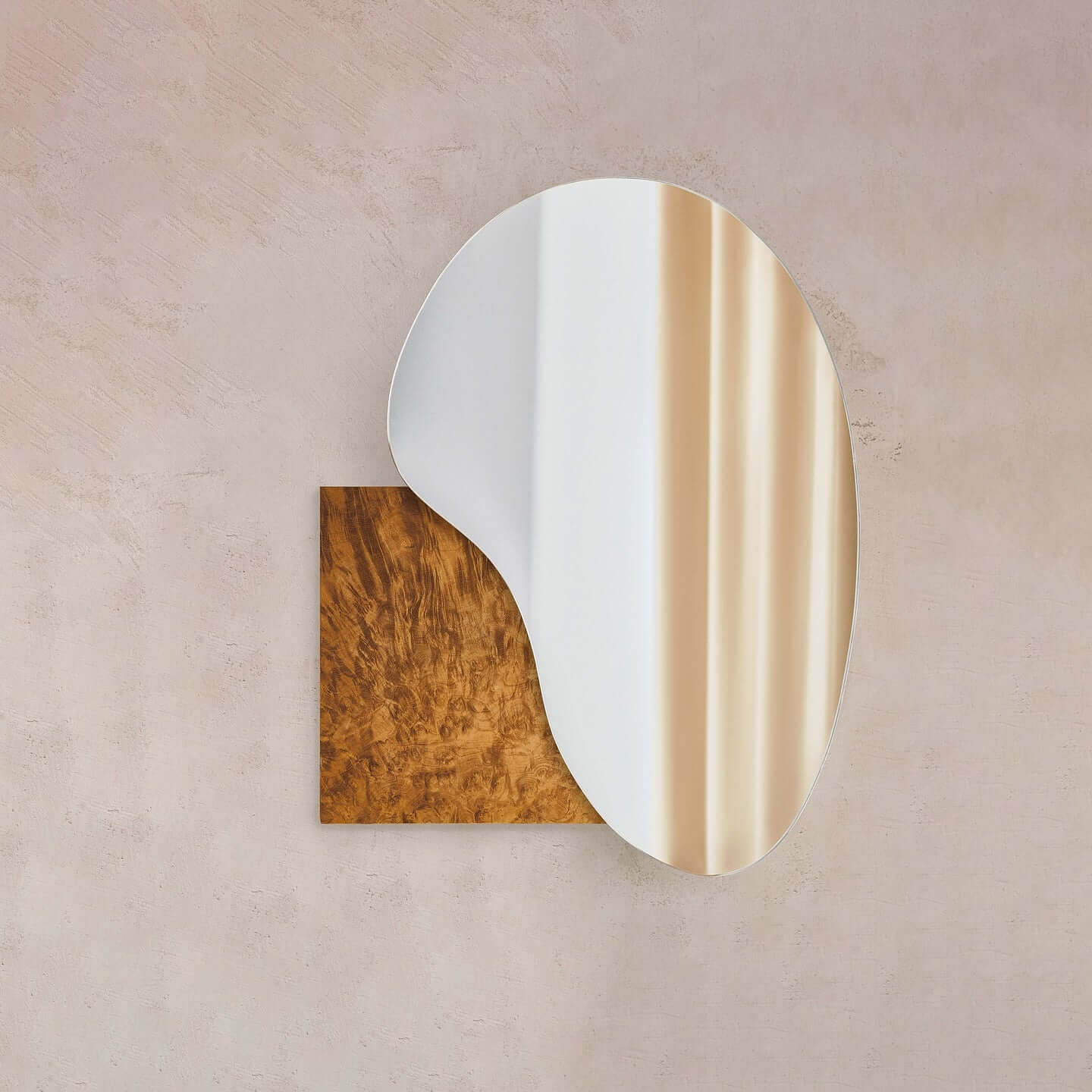 Irregular lake mirror by Noom featuring a Sottsass veneer design, blending stainless steel and marble aesthetics for home decor.