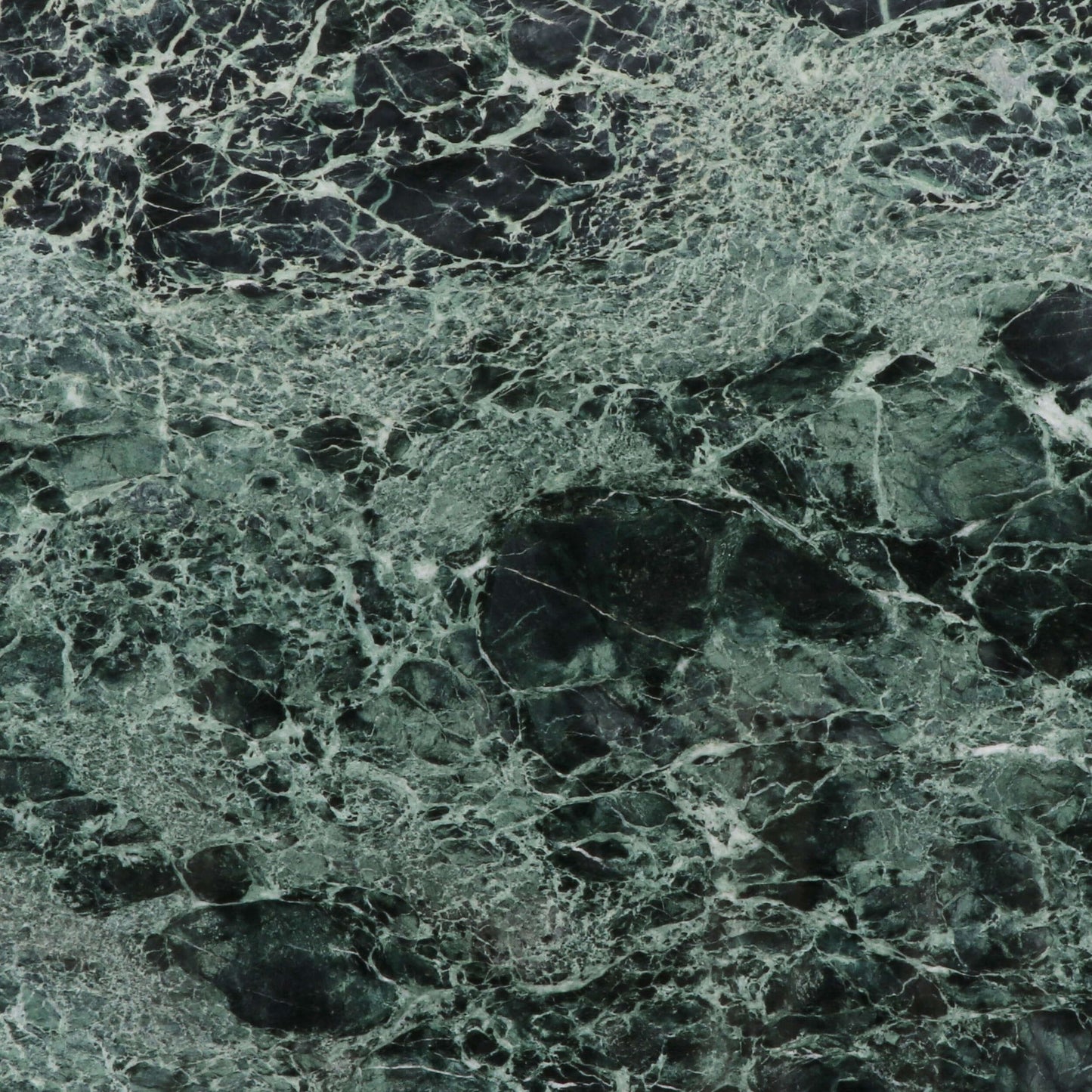 Close-up of dark green marble texture with intricate veining patterns.