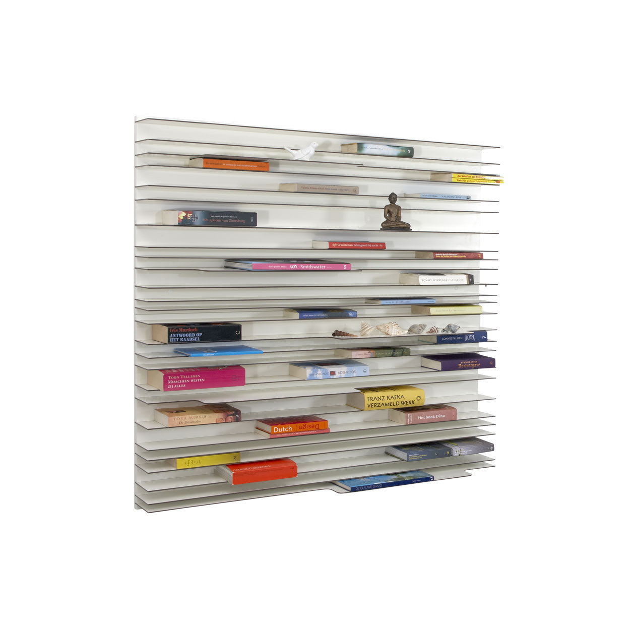 Spectrum Paperback shelving system featuring thin white shelves displaying colorful books and decorative objects.