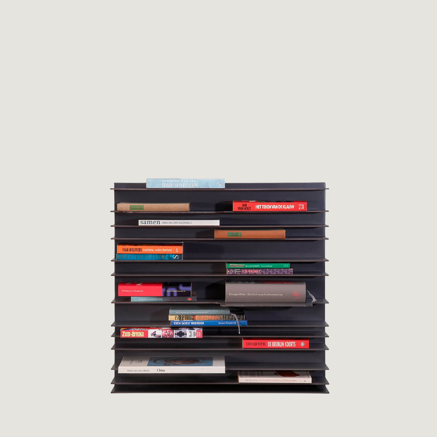 Spectrum Paperback shelving system displaying books and objects in a stylish, modern design.
