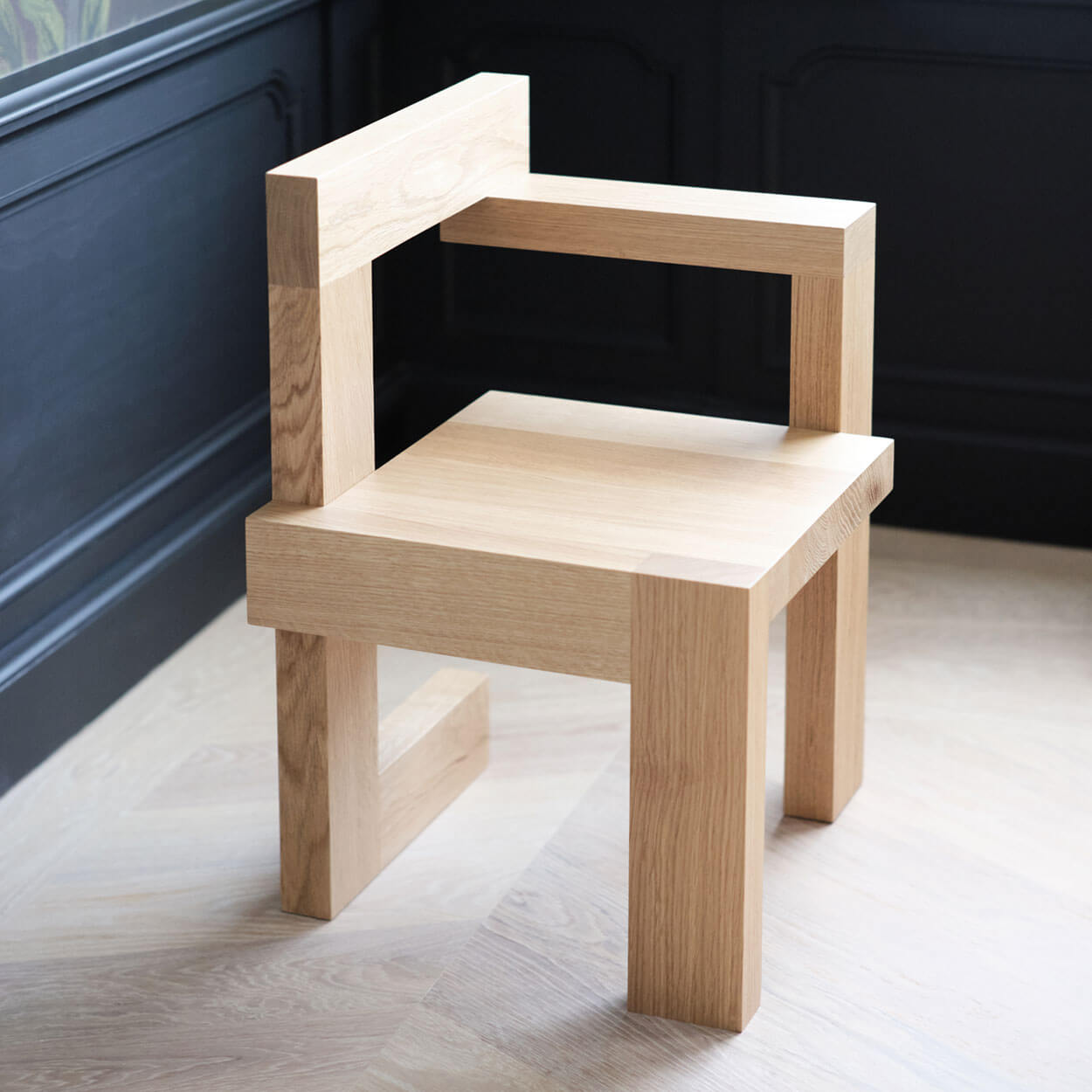 Steltman chair designed by Gerrit Rietveld showcasing minimalist wooden construction for Spectrum.