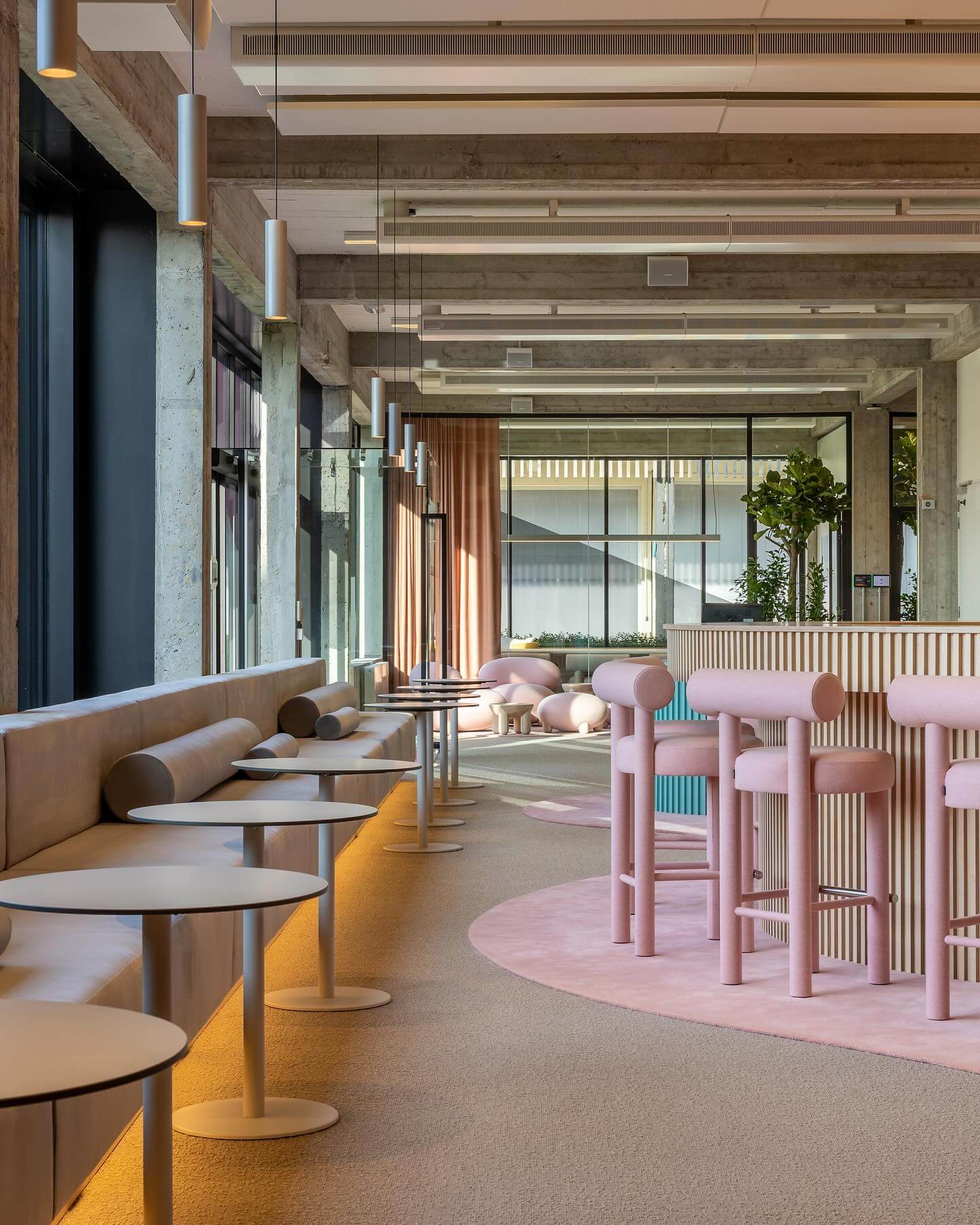 Modern interior with pink Gropius CS1 Bar Stools by Noom, designed by Kateryna Sokolova, celebrating Bauhaus School anniversary.