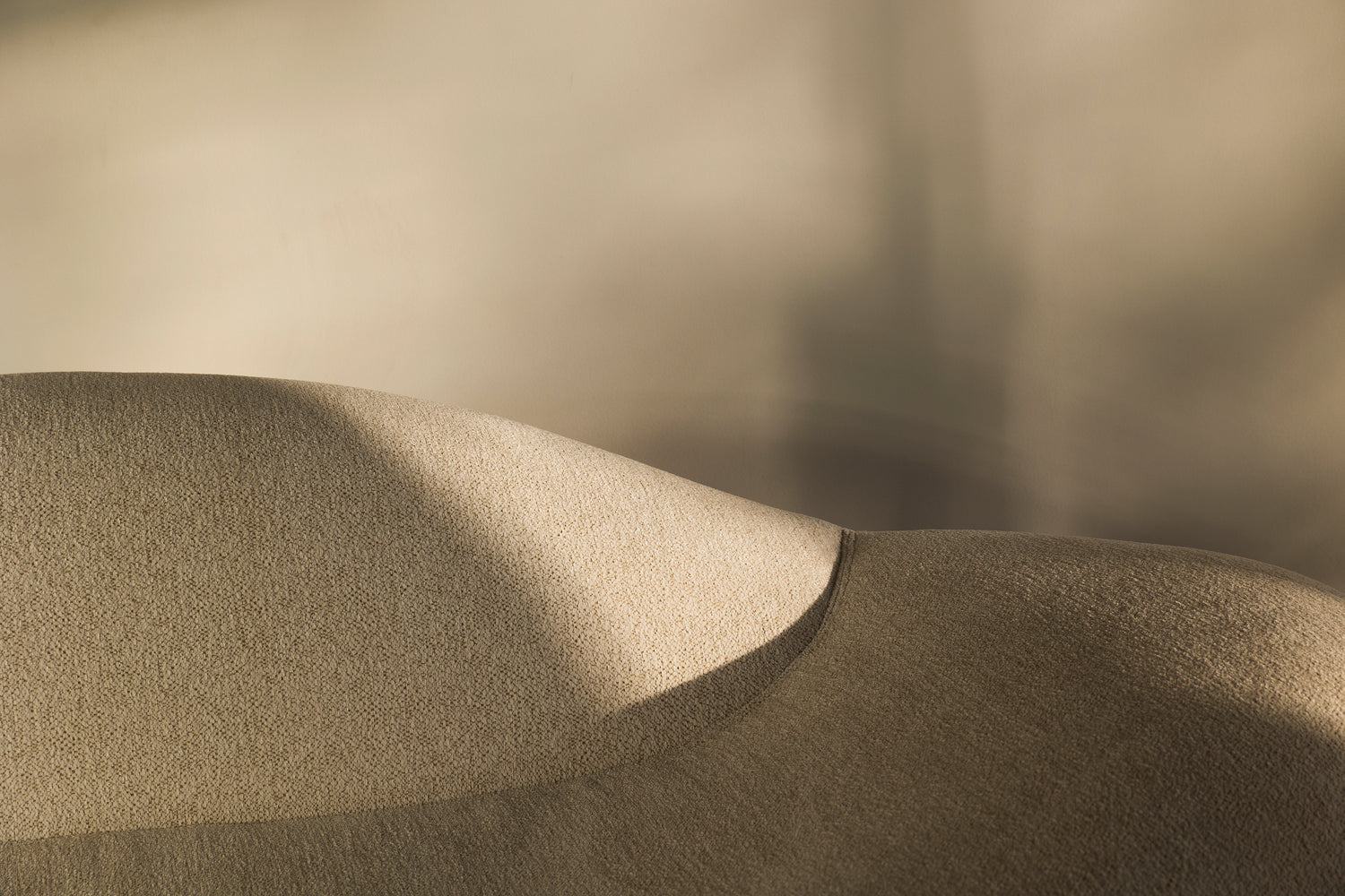 Close-up of the Alice Sofa, a modern collectible sculptural sofa designed by Joana Teixeira, highlighting its ergonomic shape.