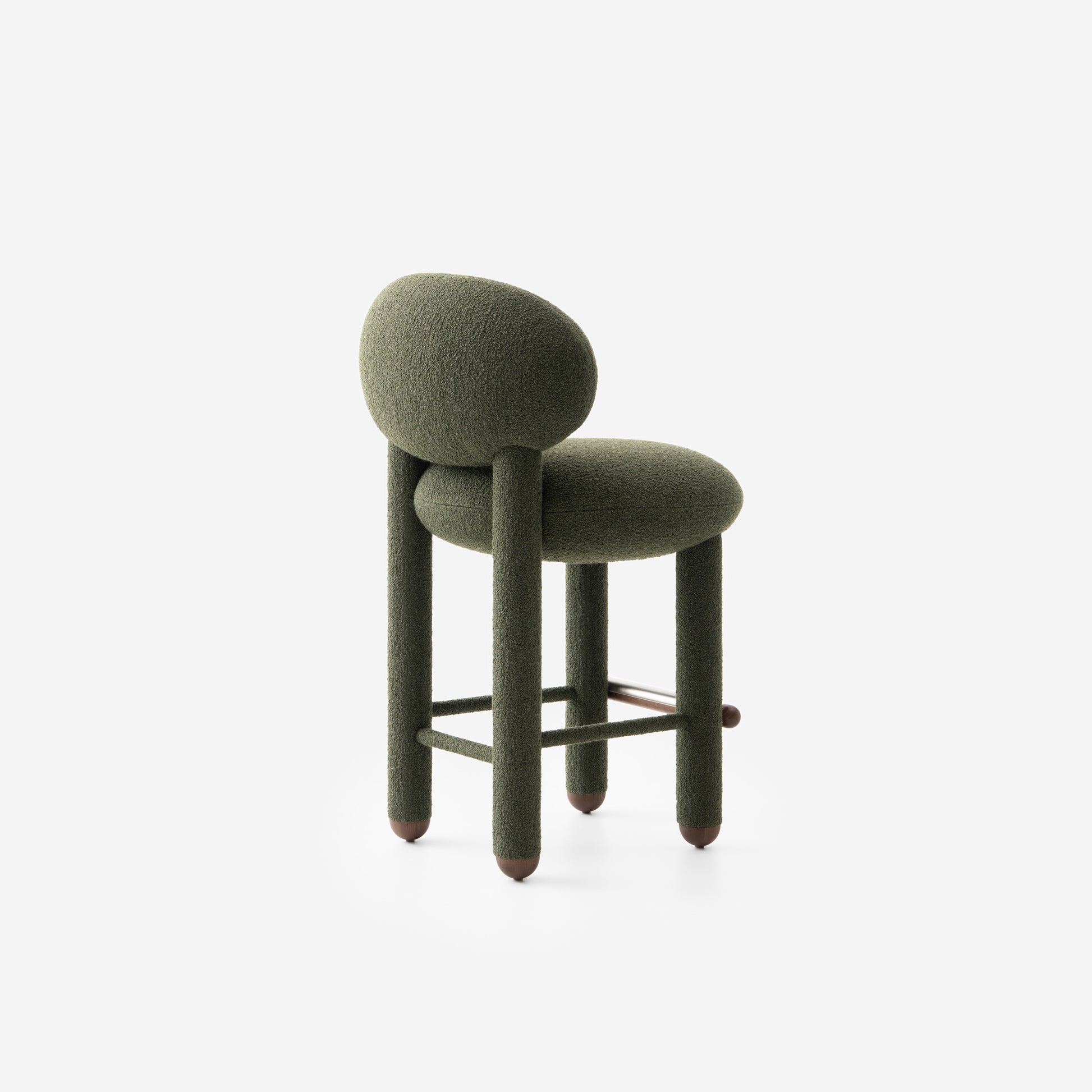 Modern designer Flock CS1 bar stool by NOOM in elegant green fabric, featuring a soft seat and curved backrest.