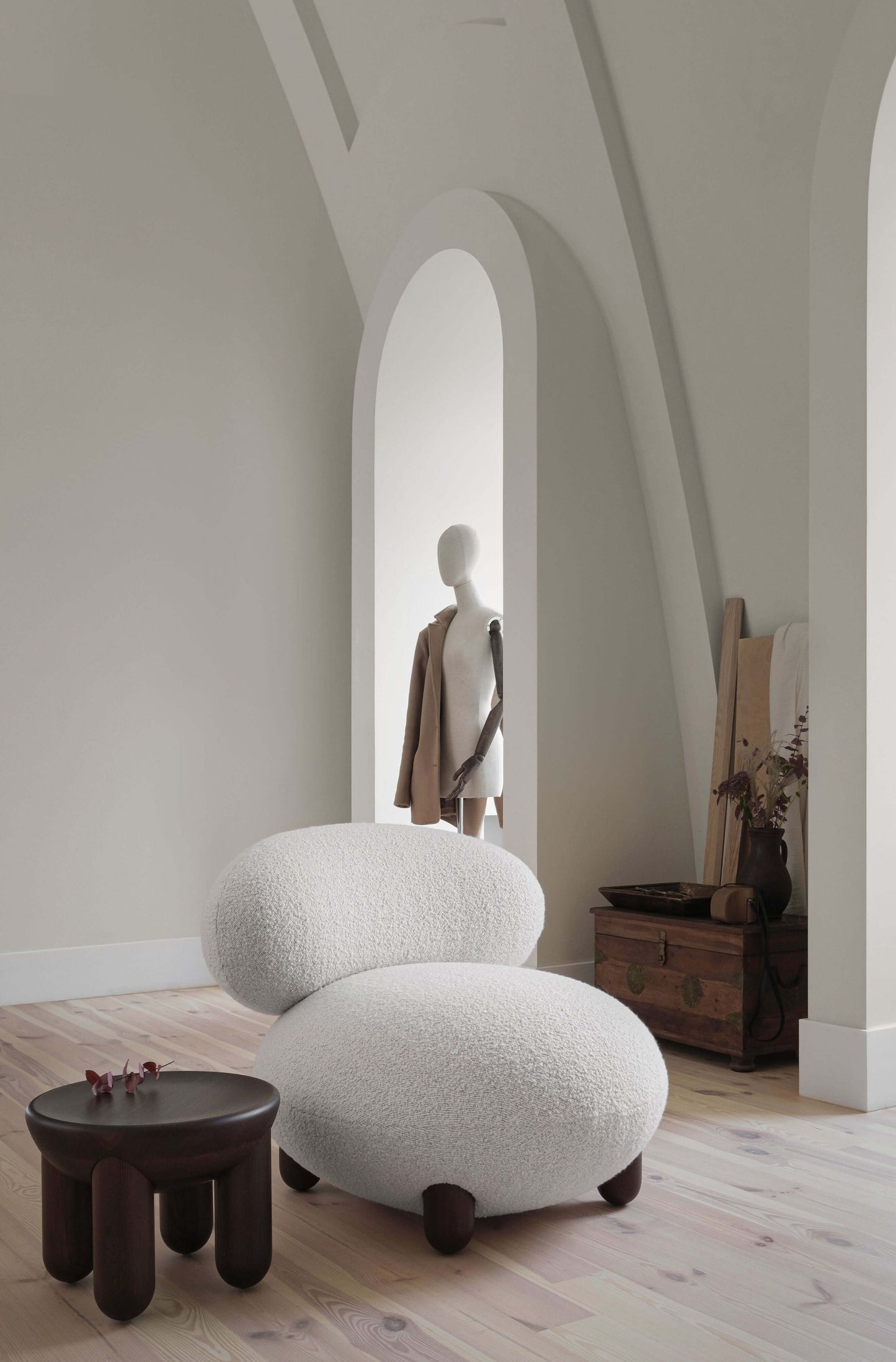 Flock lounge chair by Noom in modern living room with soft forms and natural materials, designed by Kateryna Sokolova.