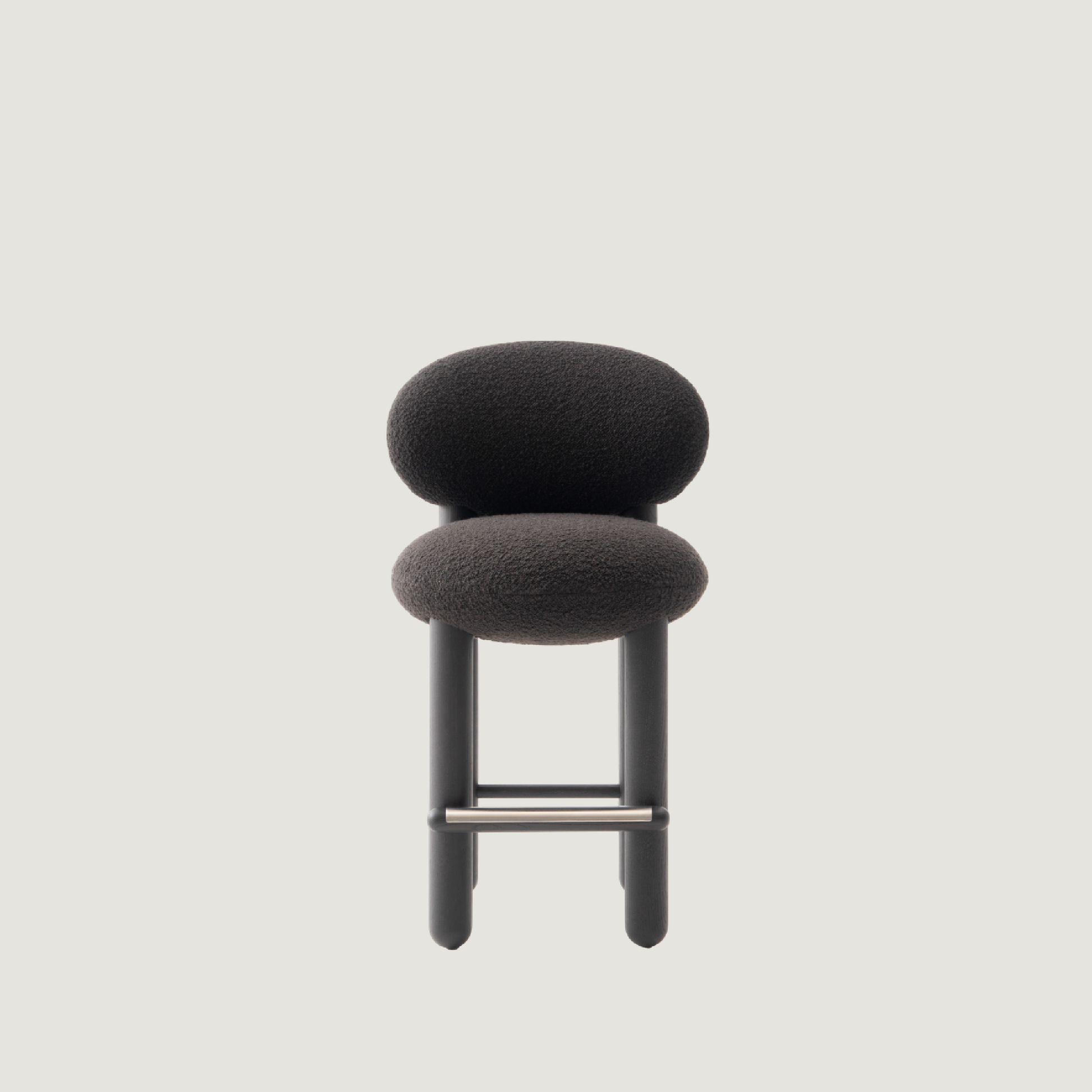 Modern designer Flock CS2 bar stool by NOOM, featuring a soft seat and curved back design for comfort and elegance.